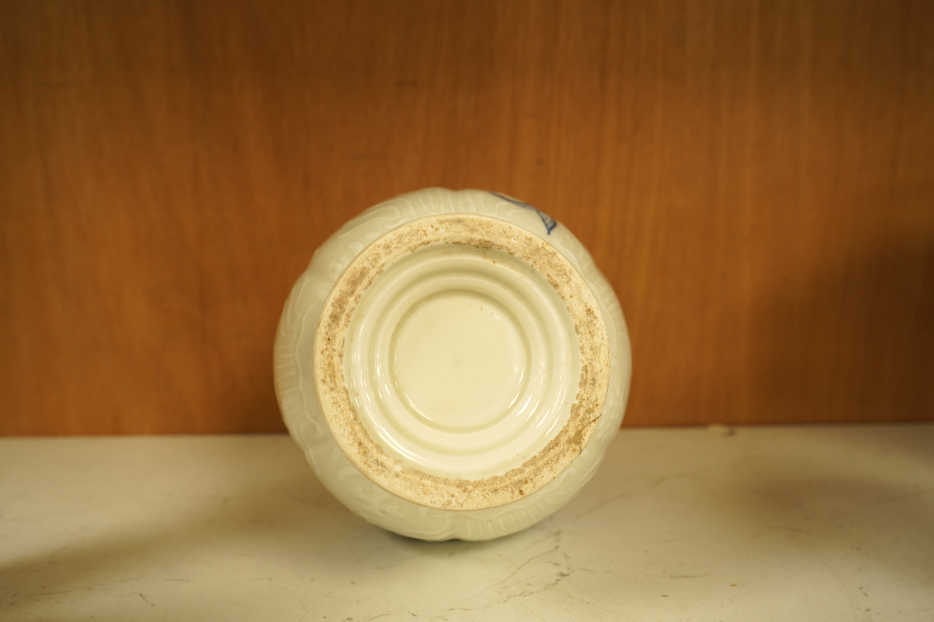 A Chinese vase decorated in low relief, hand painted with fish, 20cm high